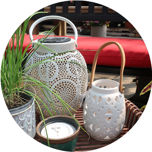 Two white lanterns with different patterns and designs.